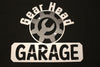 Gear head garage sign in painted black and silver